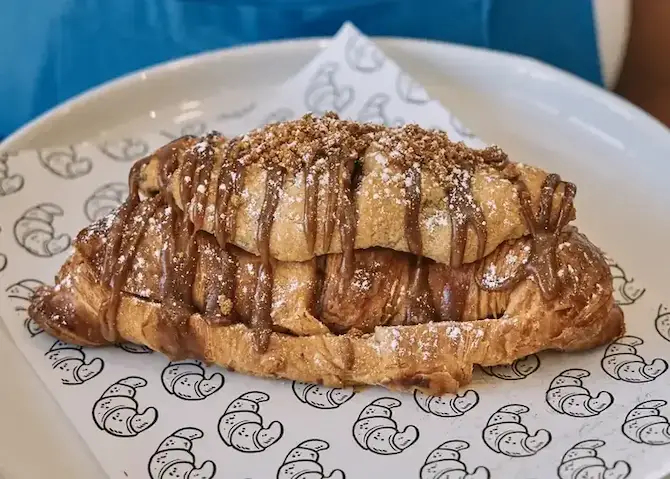 Chocolate-drizzled croissant on Jacques Bakery paper