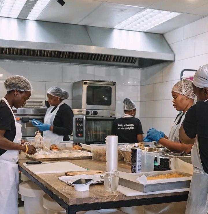 Jacques Bakery team working beside the kitchen oven