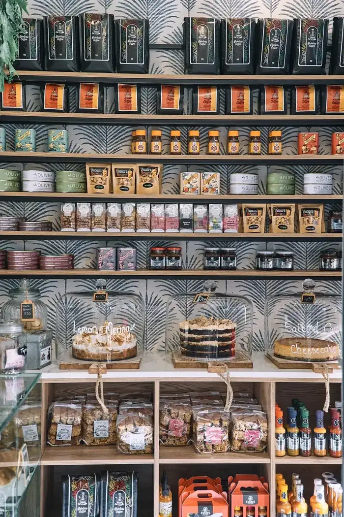 Jacques Bakery shelves with cakes under glass domes